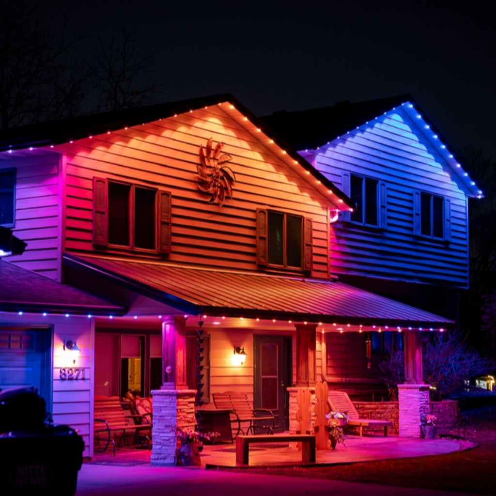 Orange and purple accent lighting on a covered porch home